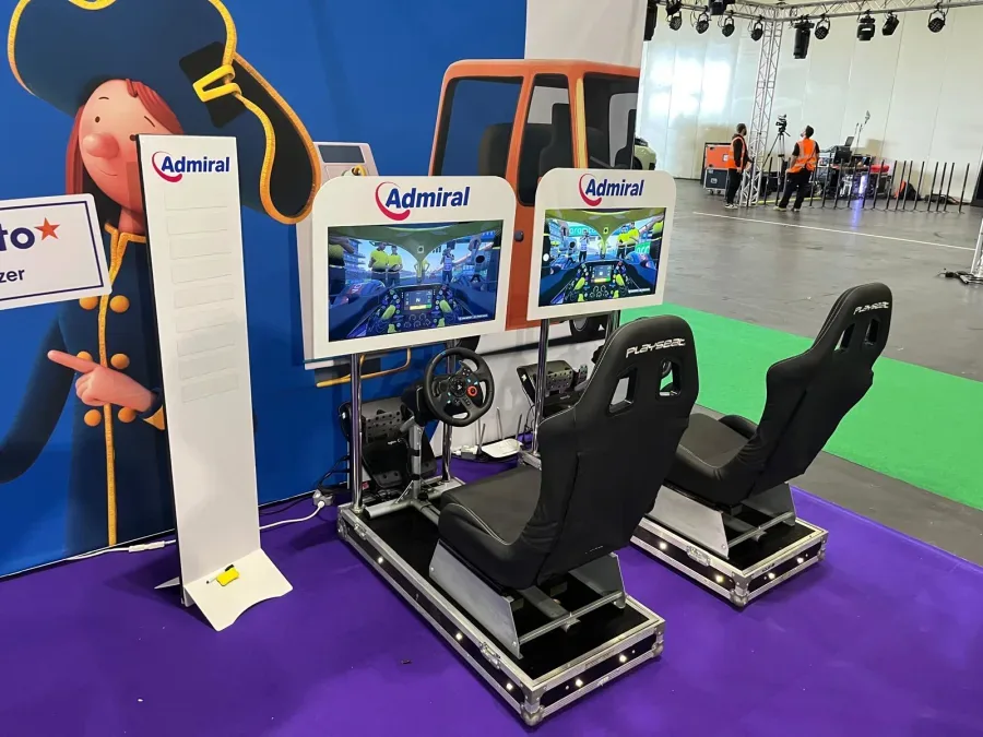 Branded racing simulators with a digital leaderboard totem