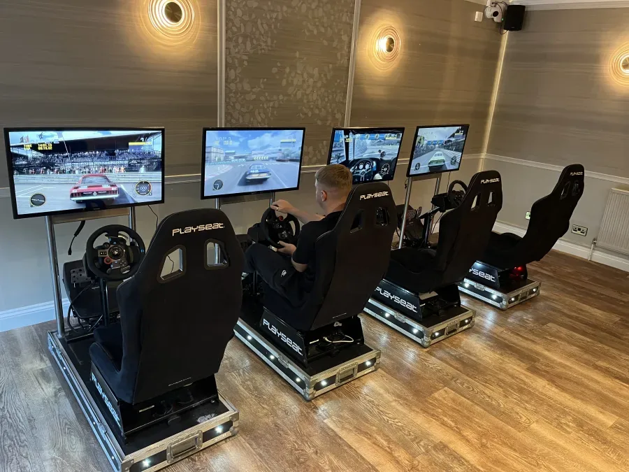 Racing simulators running a road car race on a famous circuit
