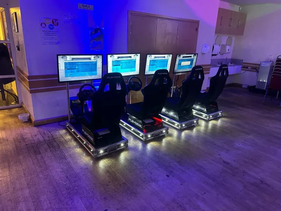 Four racing simulators set up for a party